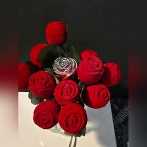 11 Red Roses That Hold Rings Or Messages and 1 Silver Metal Rose Ring Holder.